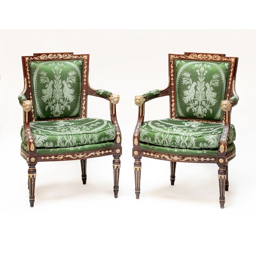 The Viceroy of Savoy Neoclassical armchairs.A pair of Italian  carved  walnut and pastiglia cream and brown painted armchairs